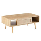 Table basse moderne en rotin JVNOXK de 105 cm avec porte coulissante de rangement, pieds en bois massif, adaptée au salon, dispose d'un espace de rangement, naturelle