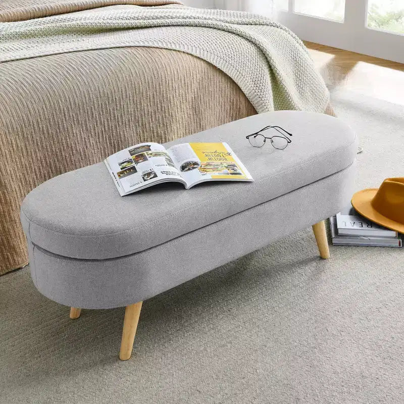 Banc de rangement ovale avec pieds en hévéa, Pouf capitonné moderne - ModernLuxe