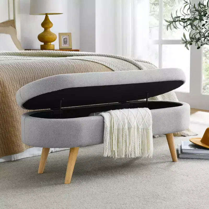 Banc de rangement ovale avec pieds en hévéa, Pouf capitonné moderne - ModernLuxe
