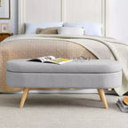 Banc de rangement ovale avec pieds en hévéa, Pouf capitonné moderne - ModernLuxe