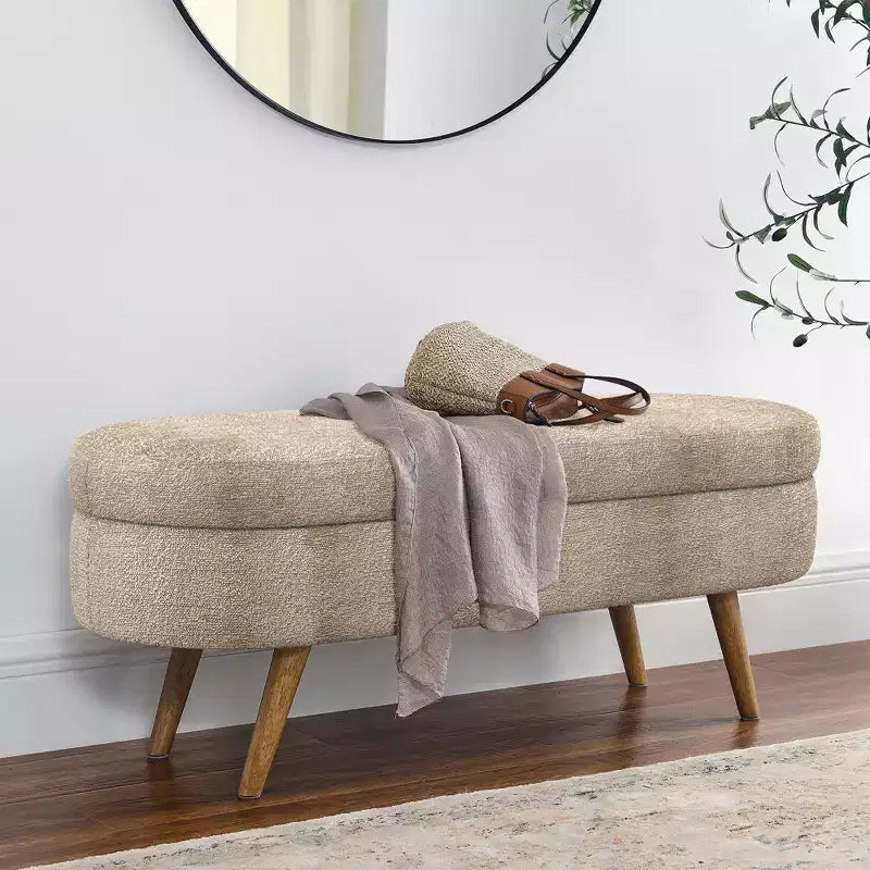 Banc de rangement ovale avec pieds en hévéa, Pouf capitonné moderne - ModernLuxe