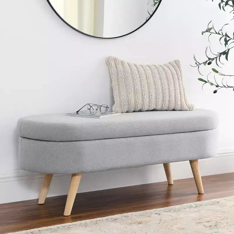 Banc de rangement ovale avec pieds en hévéa, Pouf capitonné moderne - ModernLuxe